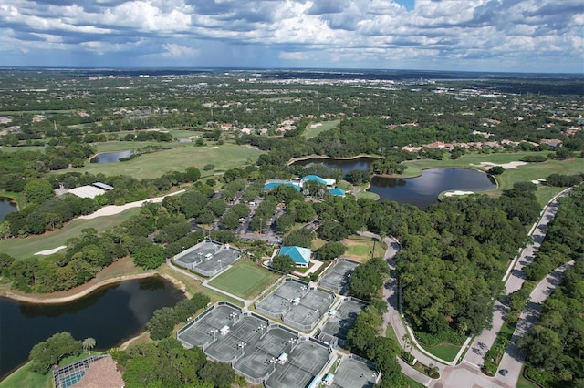view of property location featuring a nearby body of water and a golf club