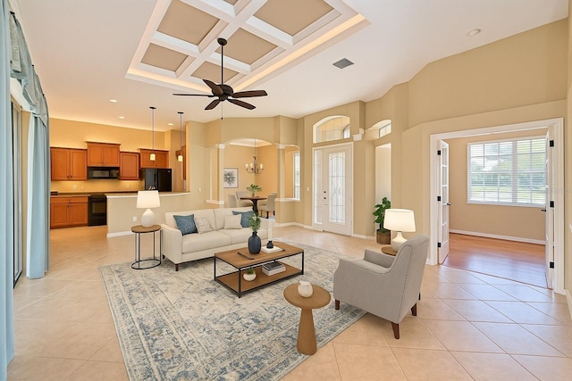 15518 29th St E, Parrish, FL 34219 - living room featuring light tile patterned floors, arched walkways, coffered ceiling, ceiling fan, and recessed lighting