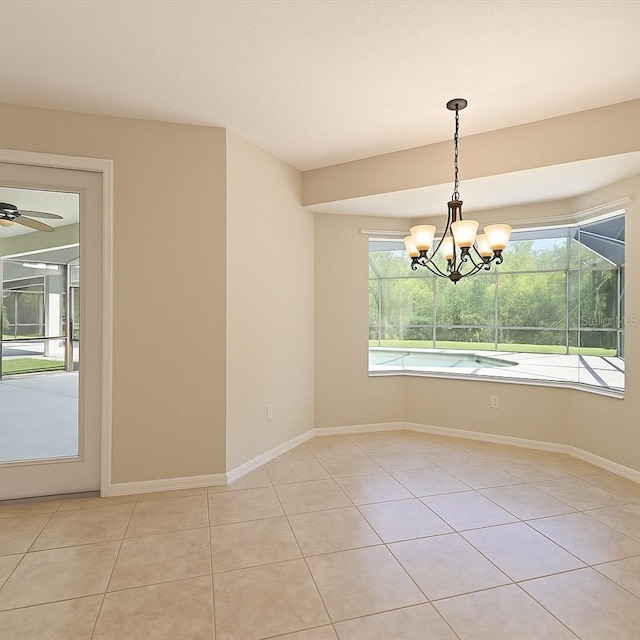 15518 29th St E, Parrish, FL 34219 - spare room featuring light tile patterned floors, baseboards, a chandelier, and a ceiling fan
