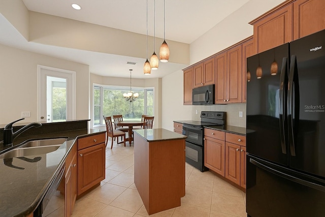 15518 29th St E, Parrish, FL 34219 - kitchen with black appliances, a sink, a center island, hanging light fixtures, and backsplash