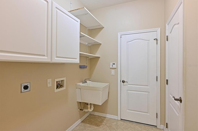 15518 29th St E, Parrish, FL 34219 - laundry area with electric dryer hookup, cabinet space, washer hookup, baseboards, and light tile patterned floors