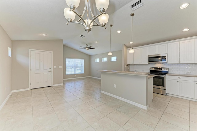 kitchen featuring a sink, stainless steel appliances, decorative backsplash, light tile patterned floors, and visible vents