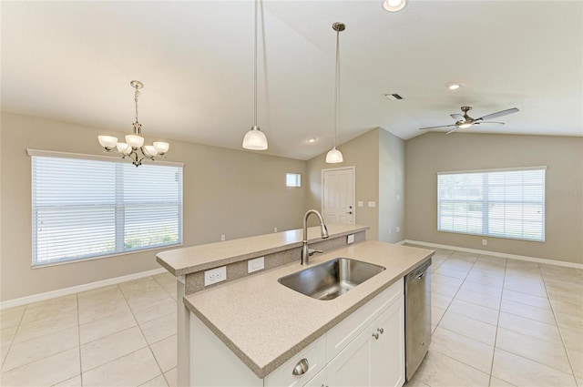 kitchen featuring a sink, light tile patterned floors, vaulted ceiling, stainless steel dishwasher, and open floor plan
