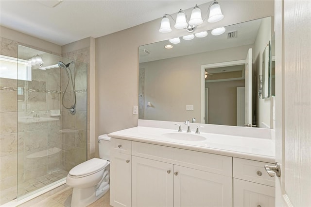 bathroom with toilet, a stall shower, visible vents, and vanity