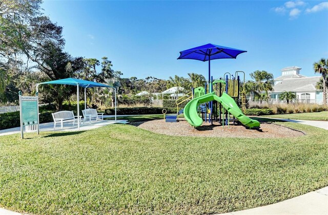 communal playground featuring a yard
