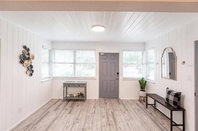 104 Shoreland Dr, Osprey, FL 34229 - foyer entrance featuring wooden ceiling, wooden walls, and light wood-type flooring