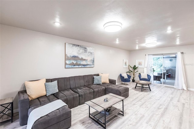 104 Shoreland Dr, Osprey, FL 34229 - living room featuring light wood-style floors and baseboards