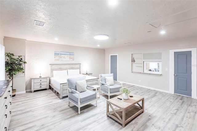 104 Shoreland Dr, Osprey, FL 34229 - bedroom with attic access, baseboards, light wood finished floors, and visible vents