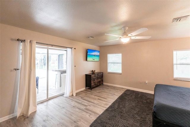 104 Shoreland Dr, Osprey, FL 34229 - bedroom featuring baseboards, visible vents, light wood-style floors, and access to exterior