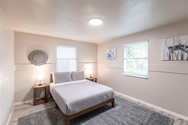 104 Shoreland Dr, Osprey, FL 34229 - bedroom featuring baseboards and wood finished floors