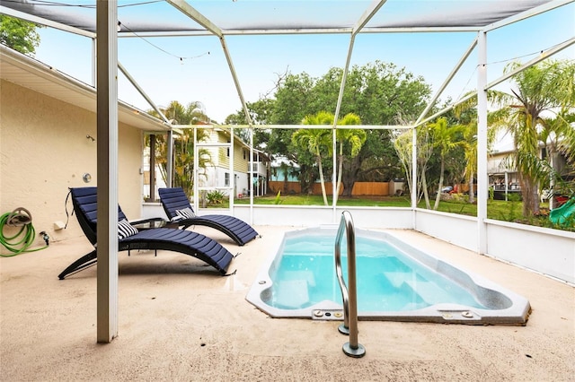 104 Shoreland Dr, Osprey, FL 34229 - outdoor pool featuring glass enclosure and a patio area