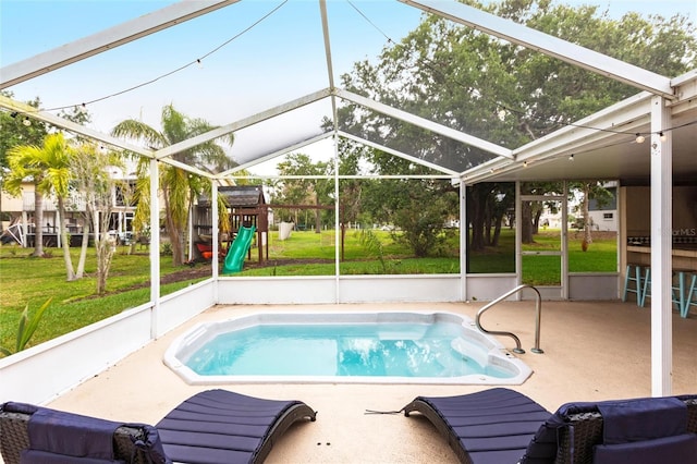 104 Shoreland Dr, Osprey, FL 34229 - outdoor pool with a patio area, a lanai, a yard, and a playground