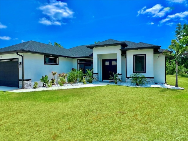 22 Medalist Cir, Rotonda West, FL 33947 - prairie-style house with a front yard, roof with shingles, an attached garage, and stucco siding