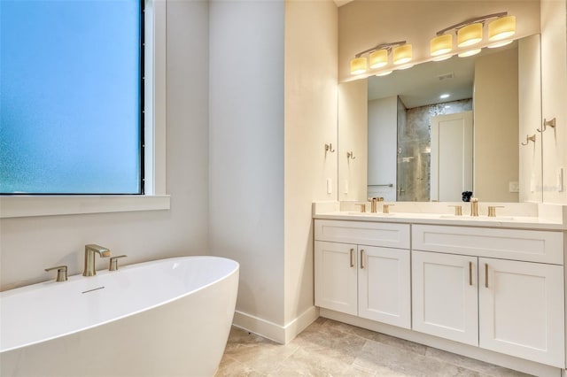 22 Medalist Cir, Rotonda West, FL 33947 - bathroom featuring double vanity, baseboards, a stall shower, and a sink
