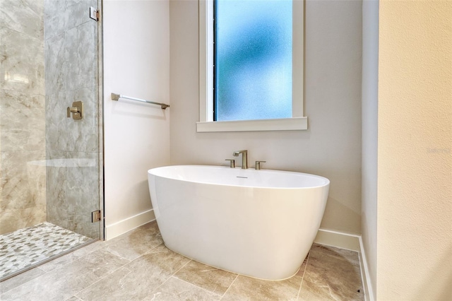 22 Medalist Cir, Rotonda West, FL 33947 - bathroom featuring a shower stall, a soaking tub, and baseboards
