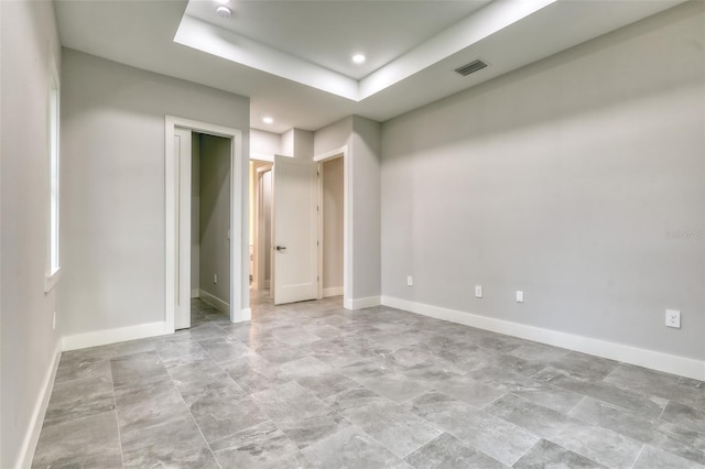 22 Medalist Cir, Rotonda West, FL 33947 - spare room with a raised ceiling, visible vents, recessed lighting, and baseboards