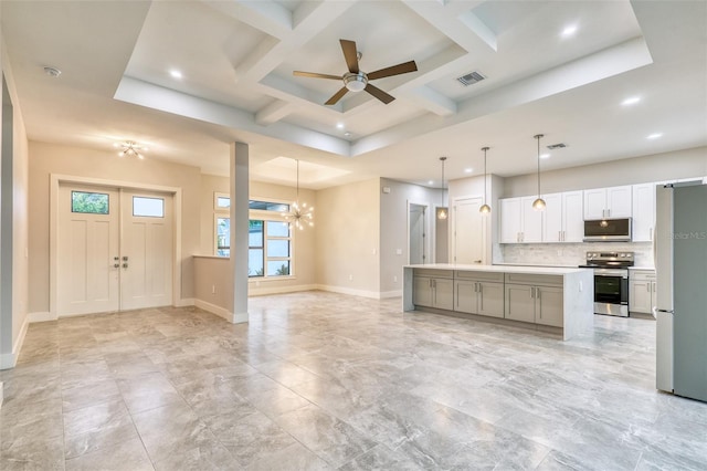22 Medalist Cir, Rotonda West, FL 33947 - kitchen with tasteful backsplash, appliances with stainless steel finishes, visible vents, open floor plan, and ceiling fan with notable chandelier