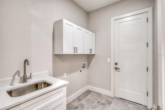 22 Medalist Cir, Rotonda West, FL 33947 - clothes washing area featuring hookup for a washing machine, electric dryer hookup, cabinet space, a sink, and baseboards