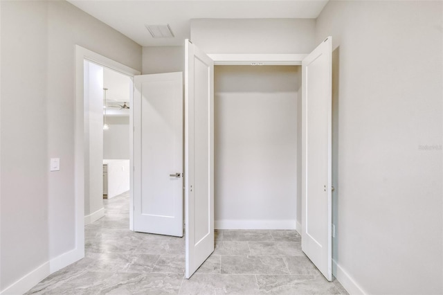 22 Medalist Cir, Rotonda West, FL 33947 - unfurnished bedroom featuring visible vents and baseboards