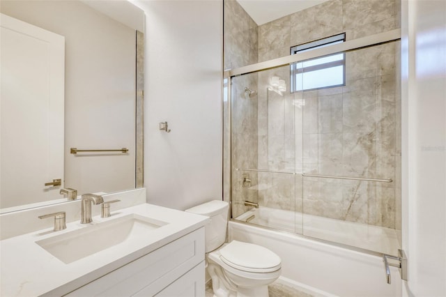 22 Medalist Cir, Rotonda West, FL 33947 - bathroom featuring bath / shower combo with glass door, toilet, and vanity
