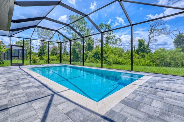 22 Medalist Cir, Rotonda West, FL 33947 - outdoor pool featuring a patio and a lanai