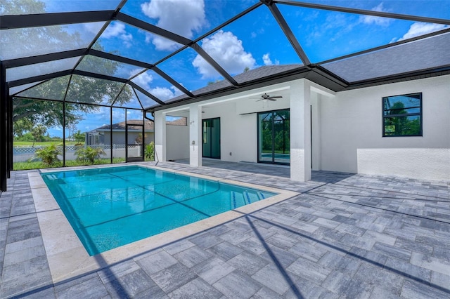 22 Medalist Cir, Rotonda West, FL 33947 - outdoor pool with a ceiling fan, a patio area, and glass enclosure