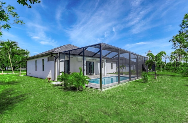 22 Medalist Cir, Rotonda West, FL 33947 - rear view of house featuring stucco siding, a yard, a patio area, a lanai, and an outdoor pool