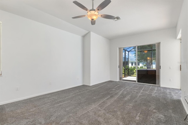 spare room featuring ceiling fan, baseboards, visible vents, and carpet