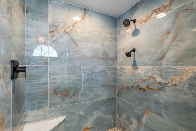 full bathroom with tiled shower