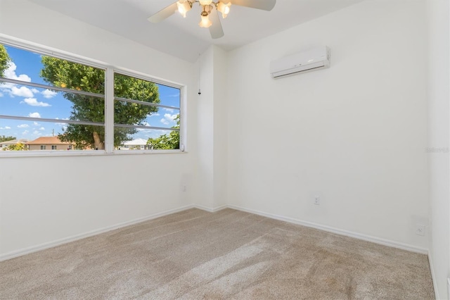 spare room with plenty of natural light, carpet floors, a wall mounted AC, and a ceiling fan