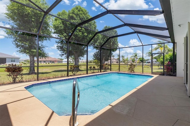 pool with a patio area, a lawn, and a lanai