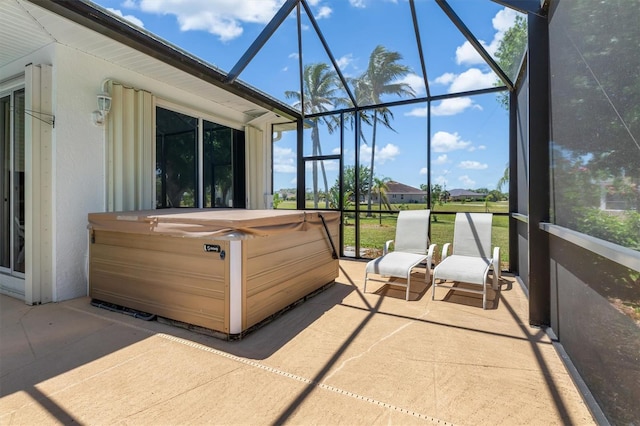 sunroom / solarium with a hot tub