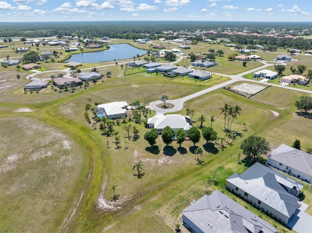 bird's eye view with a residential view and a water view