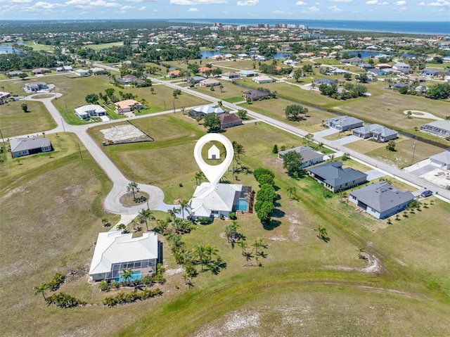 birds eye view of property with a residential view and a water view