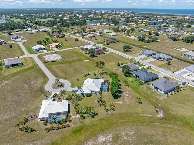 bird's eye view featuring a water view and a residential view