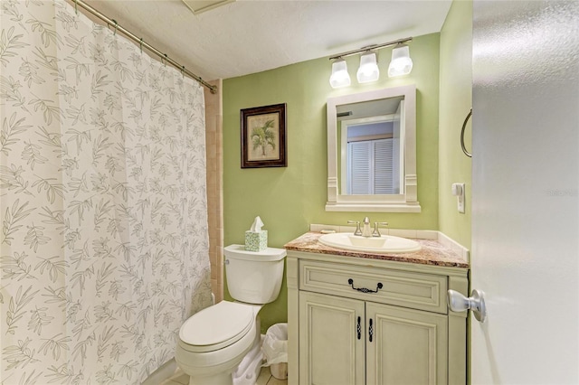 bathroom featuring toilet, a shower with curtain, vanity, and a textured ceiling