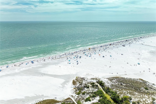 drone / aerial view with a beach view and a water view
