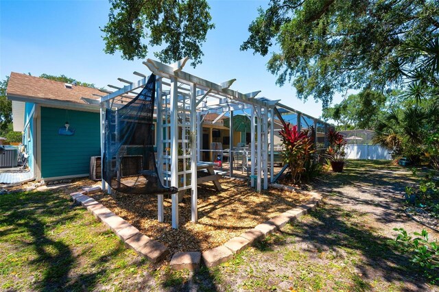 4219 Berkshire Dr, Sarasota, FL 34241 - rear view of property with fence and a pergola