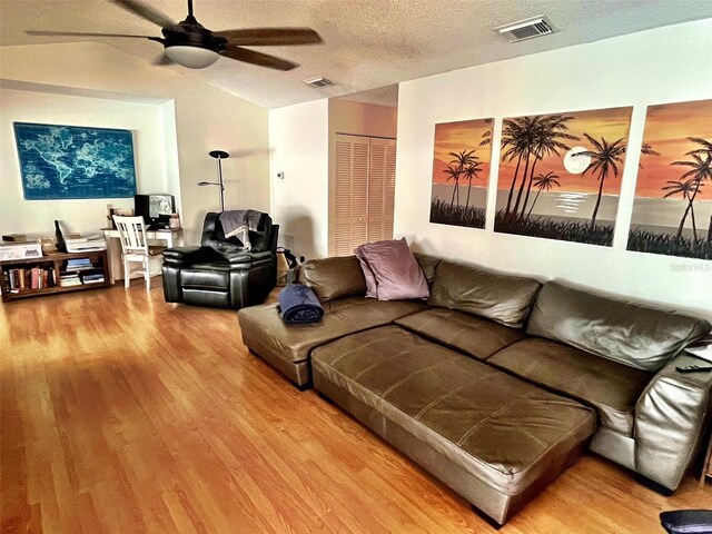 4219 Berkshire Dr, Sarasota, FL 34241 - living area with visible vents, wood finished floors, a ceiling fan, and lofted ceiling
