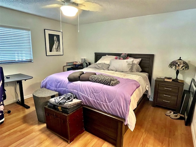 4219 Berkshire Dr, Sarasota, FL 34241 - bedroom featuring light wood-style floors, a ceiling fan, and baseboards