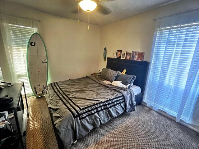 4219 Berkshire Dr, Sarasota, FL 34241 - bedroom featuring a ceiling fan and carpet floors