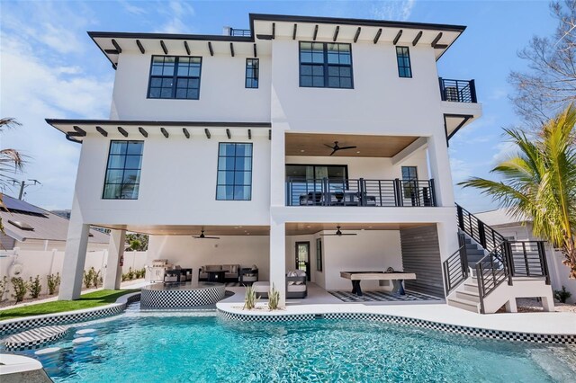 723 S Blvd Of The Presidents, Sarasota, FL 34236 - rear view of house featuring ceiling fan, an outdoor hangout area, stairs, and a balcony