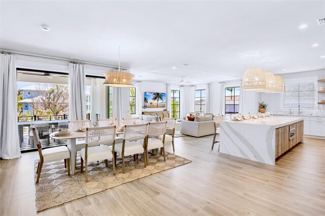 723 S Blvd Of The Presidents, Sarasota, FL 34236 - dining space featuring recessed lighting, light wood-style flooring, and visible vents