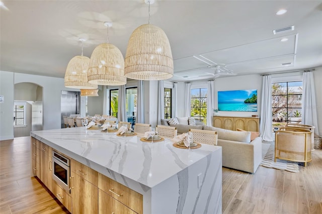723 S Blvd Of The Presidents, Sarasota, FL 34236 - kitchen featuring modern cabinets, stainless steel microwave, visible vents, and plenty of natural light