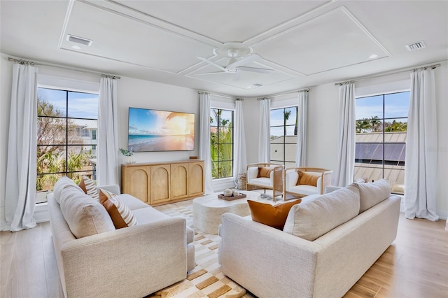723 S Blvd Of The Presidents, Sarasota, FL 34236 - living area with ceiling fan, coffered ceiling, visible vents, and light wood-type flooring