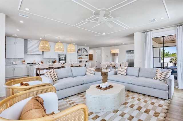 723 S Blvd Of The Presidents, Sarasota, FL 34236 - living area with light wood-type flooring, a ceiling fan, visible vents, and recessed lighting