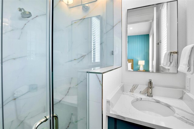 723 S Blvd Of The Presidents, Sarasota, FL 34236 - full bathroom with vanity and a marble finish shower