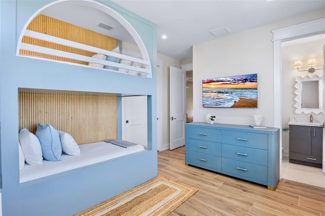 723 S Blvd Of The Presidents, Sarasota, FL 34236 - bedroom featuring light wood-type flooring, visible vents, a sink, and recessed lighting