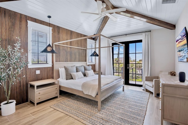 723 S Blvd Of The Presidents, Sarasota, FL 34236 - bedroom featuring beamed ceiling, wood walls, light wood-style floors, and access to exterior