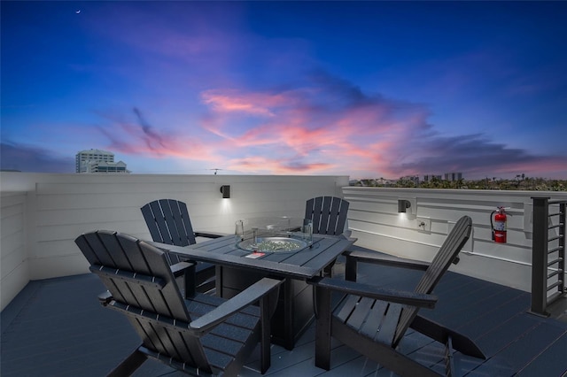 723 S Blvd Of The Presidents, Sarasota, FL 34236 - patio terrace at dusk featuring outdoor dining space
